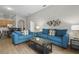 Spacious living room with teal sofas and access to dining area at 3050 Pirates Retreat Ct # 502, Kissimmee, FL 34747
