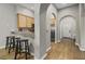 Hallway with wood-look floors and an archway leading to the kitchen at 3050 Pirates Retreat Ct # 502, Kissimmee, FL 34747