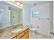 Simple bathroom with granite countertop and tub at 6556 Red Grange Blvd, Indian Lake Estates, FL 33855