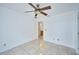 Bright bedroom with ceiling fan and tile floors at 6556 Red Grange Blvd, Indian Lake Estates, FL 33855
