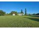 Large backyard with a shed and plenty of space for outdoor activities at 6556 Red Grange Blvd, Indian Lake Estates, FL 33855
