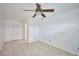 Bright bedroom featuring tile floors and ceiling fan at 6556 Red Grange Blvd, Indian Lake Estates, FL 33855
