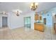Open dining room, kitchen, and view to backyard at 6556 Red Grange Blvd, Indian Lake Estates, FL 33855