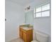 Clean bathroom with granite vanity and tiled floor at 6556 Red Grange Blvd, Indian Lake Estates, FL 33855
