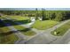 House situated on a corner lot with ample green space at 6556 Red Grange Blvd, Indian Lake Estates, FL 33855