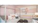 Charming bedroom with a pink and white color scheme and a four-poster bed at 1960 Rosewood Cir, Lakeland, FL 33810