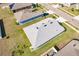 Aerial view of a house showcasing a well-maintained roof and surrounding landscape at 6048 Forest Ridge Ln, Winter Haven, FL 33881