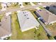 Aerial view of a house showcasing a well-maintained roof and surrounding landscape at 6048 Forest Ridge Ln, Winter Haven, FL 33881