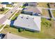 Aerial view of a house showcasing a well-maintained roof and surrounding landscape at 6048 Forest Ridge Ln, Winter Haven, FL 33881