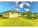 Home's backyard with grassy area at 6048 Forest Ridge Ln, Winter Haven, FL 33881