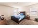 Bright bedroom with a double bed and a wooden nightstand at 6048 Forest Ridge Ln, Winter Haven, FL 33881