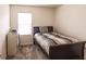 Small bedroom with double bed and window at 6048 Forest Ridge Ln, Winter Haven, FL 33881