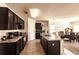Spacious kitchen with an island, stainless steel appliances, and dark wood cabinets at 6048 Forest Ridge Ln, Winter Haven, FL 33881