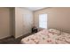 Bright bedroom with a full-size bed and window blinds at 6048 Forest Ridge Ln, Winter Haven, FL 33881