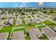 Aerial view of neighborhood with lake access at 6048 Forest Ridge Ln, Winter Haven, FL 33881