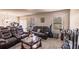 Living room with reclining sofas, a coffee table, and large windows at 6048 Forest Ridge Ln, Winter Haven, FL 33881