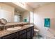 Bathroom with double vanity sinks and a walk-in shower at 6048 Forest Ridge Ln, Winter Haven, FL 33881