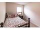 Small bedroom with double bed and window at 6048 Forest Ridge Ln, Winter Haven, FL 33881