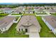 Single-Gathering home with a spacious backyard and surrounding houses at 6048 Forest Ridge Ln, Winter Haven, FL 33881