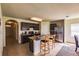 Kitchen with dark cabinets, stainless steel appliances, and an island at 6048 Forest Ridge Ln, Winter Haven, FL 33881