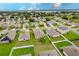 Aerial view of neighborhood showcasing homes and landscape at 6048 Forest Ridge Ln, Winter Haven, FL 33881