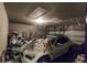 Garage with car and storage items at 6048 Forest Ridge Ln, Winter Haven, FL 33881