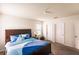 Large bedroom with a king-size bed and double door closets at 6048 Forest Ridge Ln, Winter Haven, FL 33881