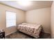 Bright bedroom with a full-size bed and window blinds at 6048 Forest Ridge Ln, Winter Haven, FL 33881