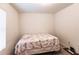 Bright bedroom with a full-size bed and window blinds at 6048 Forest Ridge Ln, Winter Haven, FL 33881