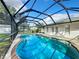 Large screened-in pool with backyard views at 1722 Montee Ln, Lakeland, FL 33811