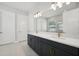 Modern bathroom with double vanity, dark cabinets, and gold fixtures at 2724 Oxford St, Orlando, FL 32803