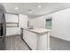 Eat-in kitchen with stainless steel appliances, granite countertops, and an island at 3816 Corsican Pl, Lake Alfred, FL 33850