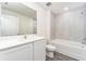 Bathroom with white vanity, toilet and bathtub at 3816 Corsican Pl, Lake Alfred, FL 33850