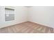 Bright bedroom with beige carpet and a window offering natural light at 3816 Corsican Pl, Lake Alfred, FL 33850