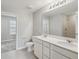 Main bathroom with double vanity and shower at 285 Woodsage Pl, Lake Alfred, FL 33850