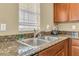 Modern double sink with granite countertop in kitchen at 5333 River Rock Rd, Lakeland, FL 33809
