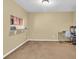 Bright dining area with carpeted floor and kitchen pass-through at 5333 River Rock Rd, Lakeland, FL 33809
