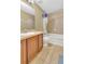 Clean bathroom with a shower/tub combo and wood vanity at 5333 River Rock Rd, Lakeland, FL 33809