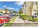 Sidewalk view of townhouse community with parking at 5333 River Rock Rd, Lakeland, FL 33809