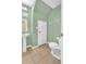 Clean bathroom with pedestal sink and toilet at 5333 River Rock Rd, Lakeland, FL 33809