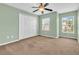 Well-lit bedroom with neutral walls and carpet at 5333 River Rock Rd, Lakeland, FL 33809