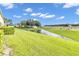 Landscaped backyard with pond view and highway access at 5333 River Rock Rd, Lakeland, FL 33809