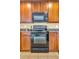 Black microwave and range in the kitchen at 5333 River Rock Rd, Lakeland, FL 33809
