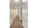 Simple hallway with neutral walls and carpet at 5333 River Rock Rd, Lakeland, FL 33809