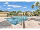 Inviting community pool with patio furniture and cabana at 5333 River Rock Rd, Lakeland, FL 33809