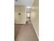 Long hallway with neutral colored carpet at 5333 River Rock Rd, Lakeland, FL 33809