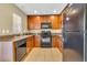 Well-equipped kitchen with wood cabinets and granite counters at 5333 River Rock Rd, Lakeland, FL 33809