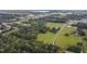 Aerial view of property with a large lot, pond, and barn at 1440 Duff Rd, Lakeland, FL 33810