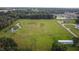 Aerial view of a spacious lot with pond and open fields at 1440 Duff Rd, Lakeland, FL 33810