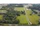 Aerial view of property with a large lot, pond, and barn at 1440 Duff Rd, Lakeland, FL 33810